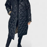 Antra – Dygsniuotas paltas su leopardo pamušalu